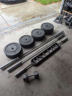 Bumper Plates, bars, and cable tower