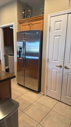 Stainless steel GE Profile side-by-side refrigerator