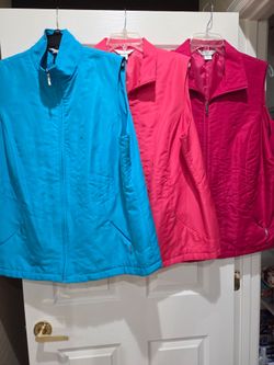 Women sz 20,  lite weight, lite filled nylon vests, like new, $5.00 ea
