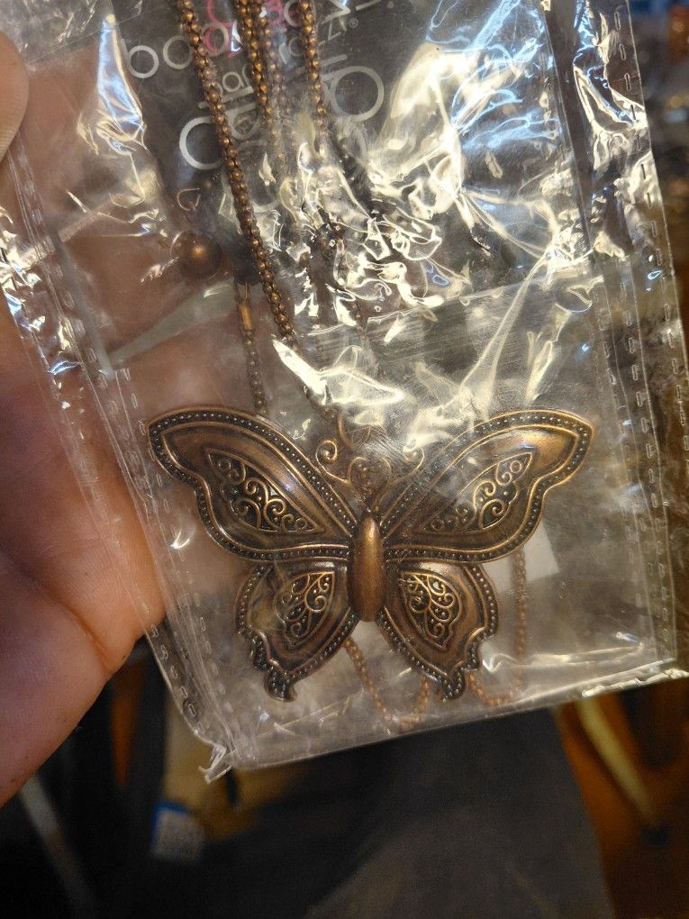 Paparazzi "Aerial Attraction" copper butterfly necklace with an adjustable clasp closure.