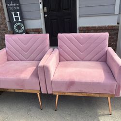 Two pink oversized accent chairs for business or home space