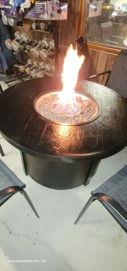 43" Round propane fire pit table sells for 400