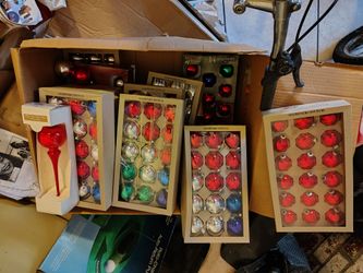 15 or 18 piece ornaments 10 dollars a box. Tree topper 5 dollars