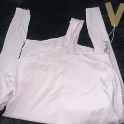 SKIMS (PINK BODY SUIT)