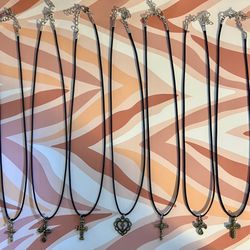 Bronze Colored Crosses On Leather Cord