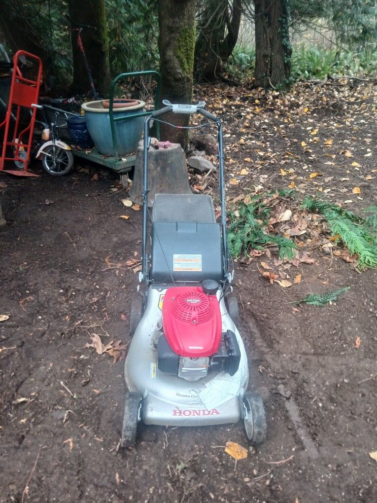 Honda, self-propelled mower runs excellent.