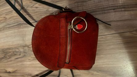 Used red mini backpack