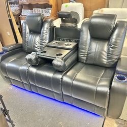 Like New 3 Months Old Leather Electric Dual Reclining Couch With Electric Headrests And Dual USB And Wireless Charging Stations And LED Lighting 