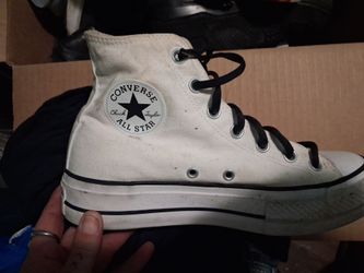 white Converse Chuck Taylor All Star high-top sneakers with black laces