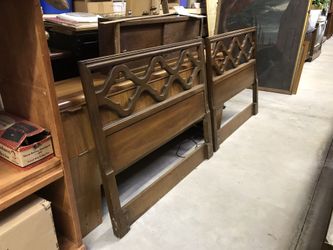 Two vintage twin headboards and also makes a King bed