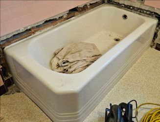 Vintage 1940s Mid-Century Modern Cast Iron Alcove Bathtub – Glossy White with hardware