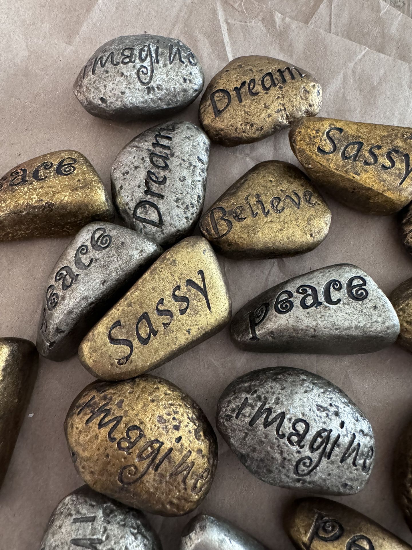 Gold And Silver Rocks Engraved With Messages