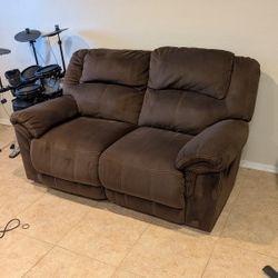 Ashley Furniture Quinnlyn - Coffee Reclining Loveseat with Reversible Couch Cover.