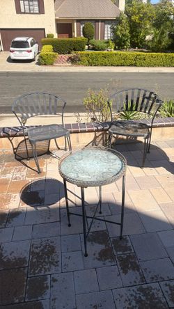 2 patio iron chairs and table