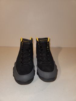 9 Retro "Dark Charcoal University Gold" sneakers.  