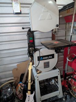 Delta 14 inch bandsaw with stand and rolling base