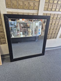 large black rectangular wall mirror,