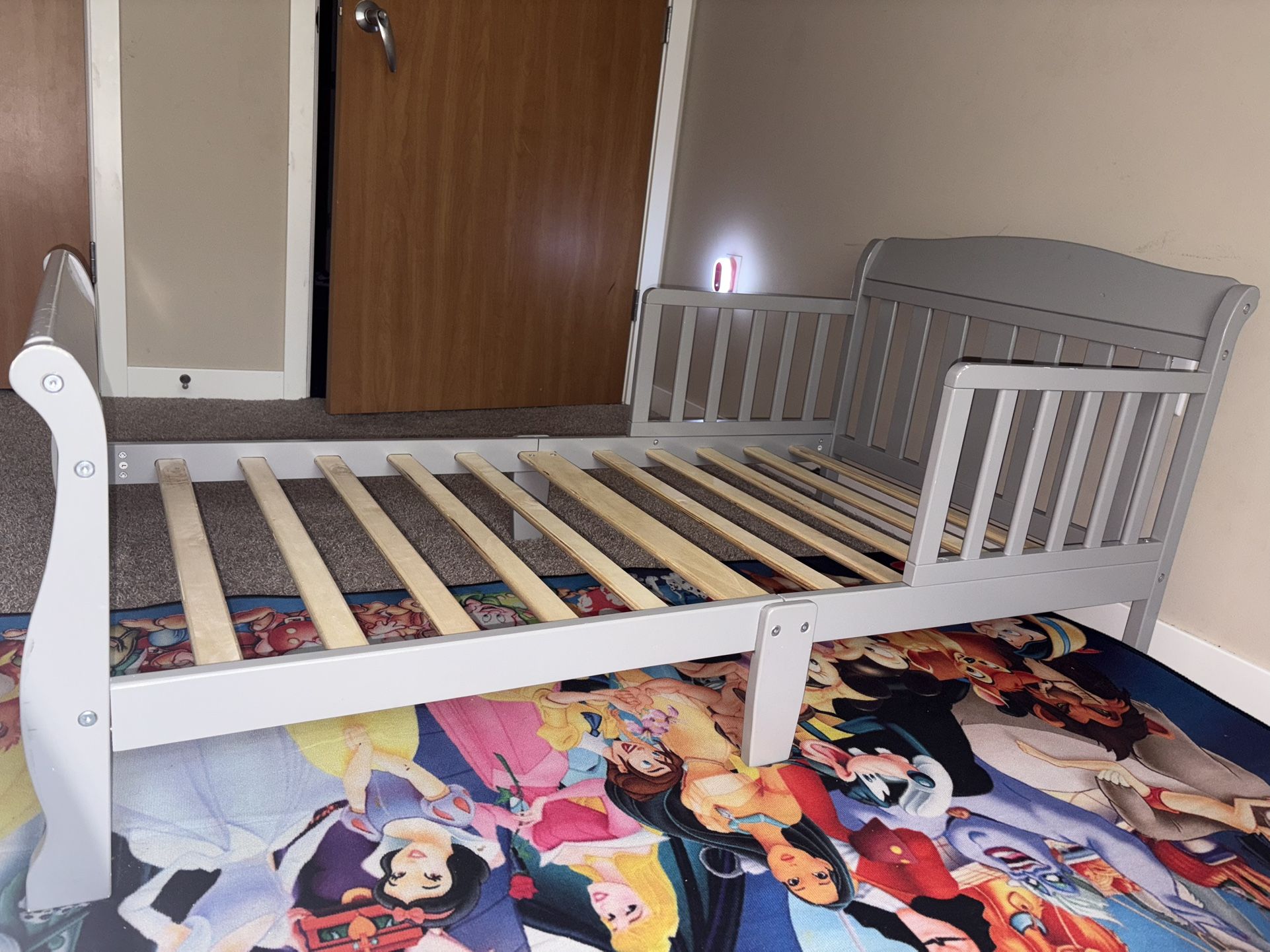 Gray toddler bed with 2 side rails