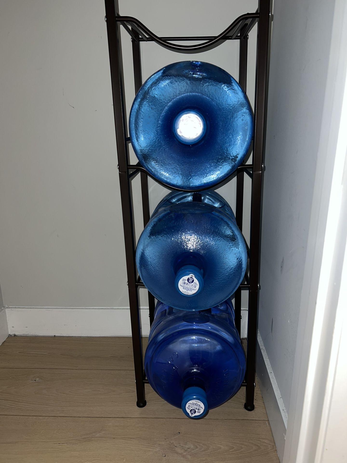 THREE 5 gallon waters AND storage rack
