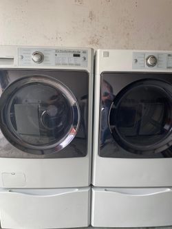 Kenmore washer and dryer electric set on pedestal