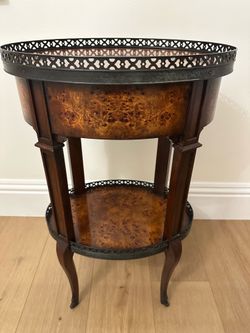 Delicate and Pierce accent table by Theadore Alexander