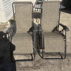 Tan Zero gravity yard chairs (2)