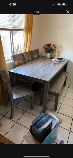 Gray table with bench and 4 chairs