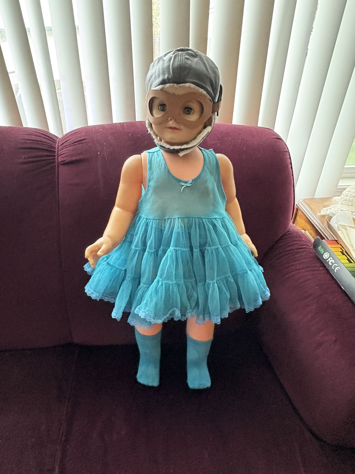 Cute vintage doll wearing a dress