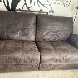 A Brown Loveseat/ Couch