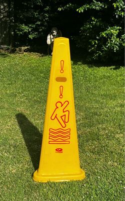 Six yellow slippery when wet cones