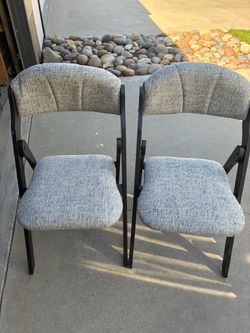 Two nice upholstered folding chairs new $50 for the pair