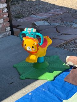 Fisher-Price Lion Spinning Sit-On Toy