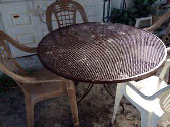 Patio table and plastic chairs