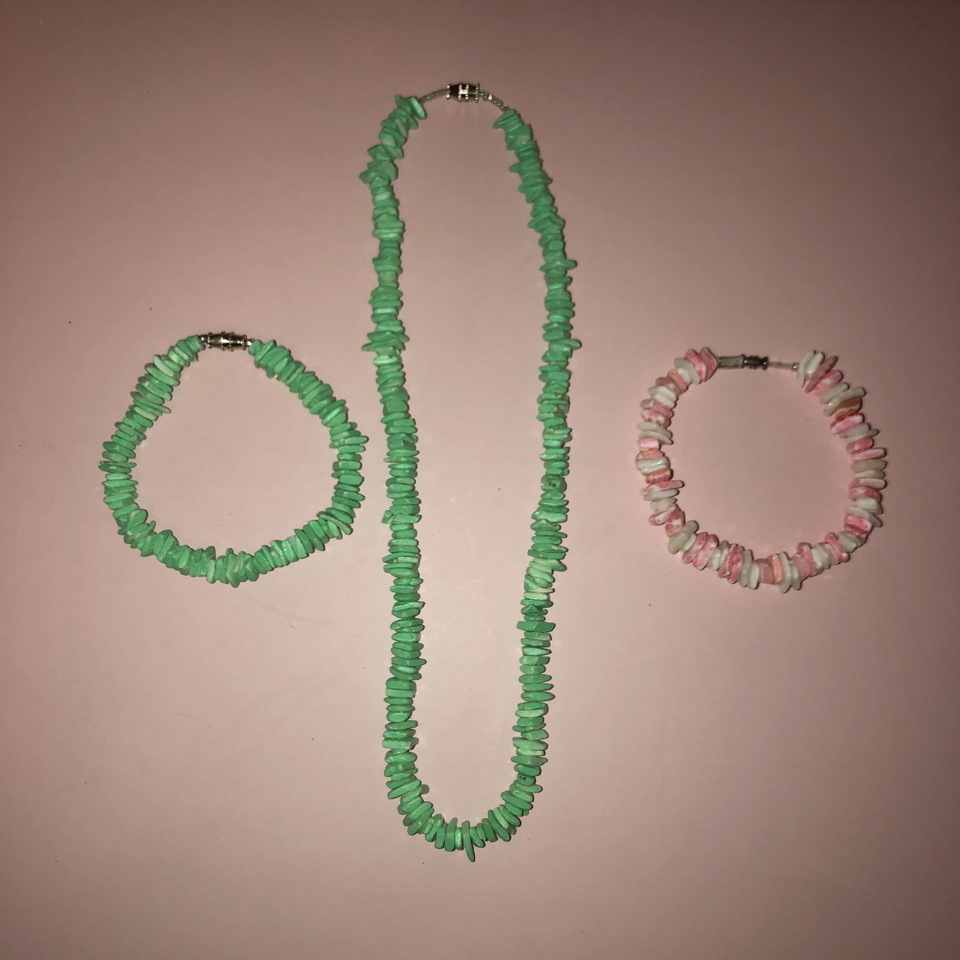 Shell jewelry bundle. A matching bracelet and necklace set that’s mint green and a pink and white bracelet. Bracelets are 8” laid flat and the neckla