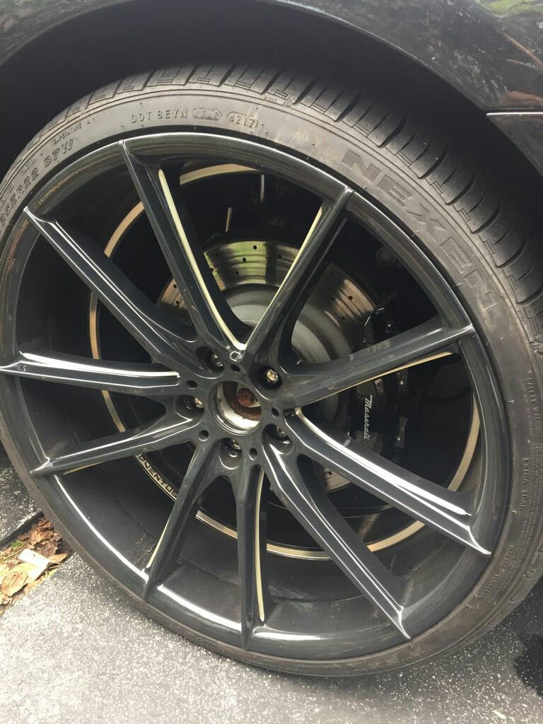 4 sets of black rims with tires altogether