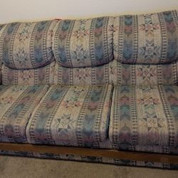 Two Couches And Table With 6 Rolling Chairs 