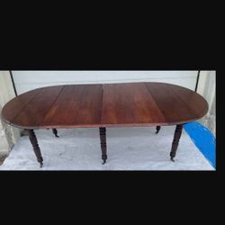 Wooden Table W/ 6 Leafs Can Be Made 4ft Round Or 8ft L 