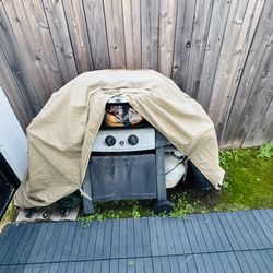 Bar-B-Q Grill with cover and propane. 