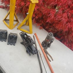 Two Jack Stands,  Hydraulic Bottle Jack,  Scissors Jack,  Chucks, Wheel Wrenches 