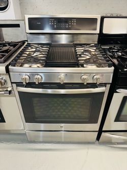 GE stainless steel natural gas stove; includes a receipt for a 90-day warranty.