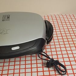 GEORGE FOREMAN GRILLING MACHINE $20.NE. 