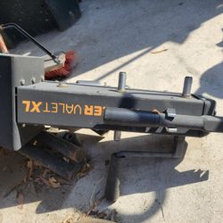 Trailer Valet, likely a model such as the 5X or a similar trailer mover.    Purpose: It is designed to assist in moving and positioning trailers manua