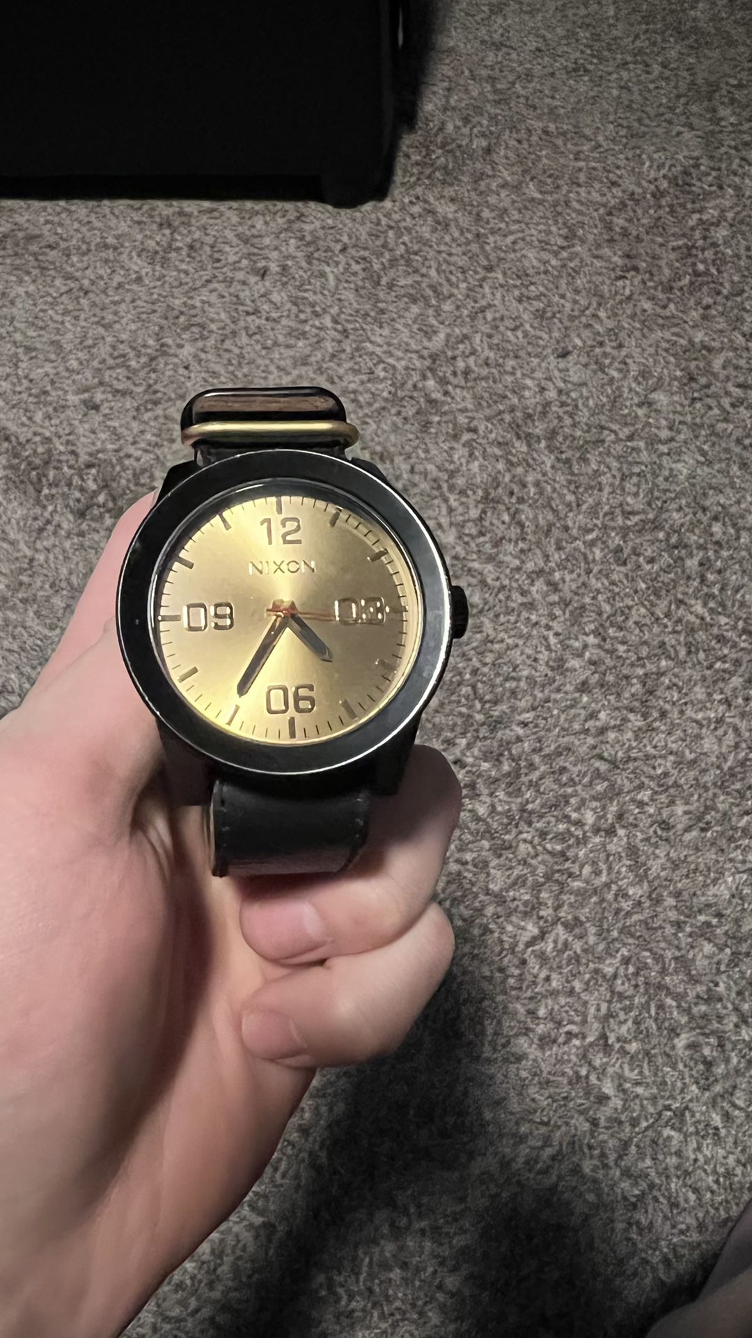 Nixon Black And Gold Watch