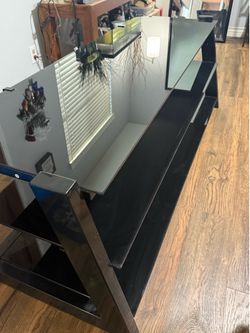 Sleek Black TV and Entertainment Stand