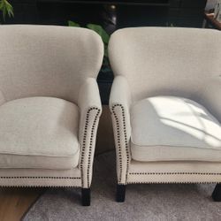 2 White Cushioned Chairs