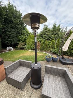 Outdoor propane heater with wheels and covered tank