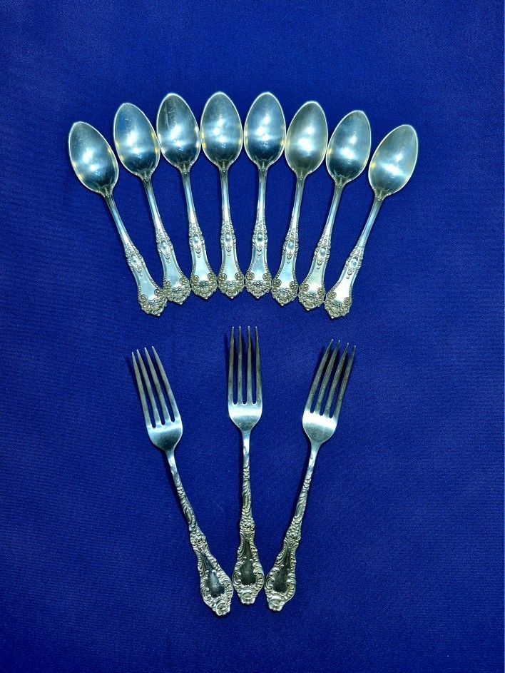 Antique flatware set of 8 spoons and 3 knives