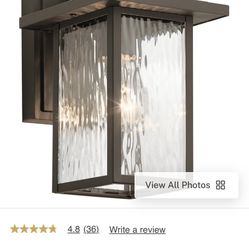 Capanna Outdoor Wall Light 1-Light | Clear Water Glass Size: 6.5" W x 10.25" H x 7.75" D Model: 49924OZ The 10" 1-light outdoor wall light from the Ca