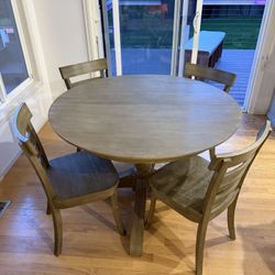 Pottery Barn dining table with leaf and chairs
