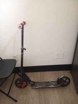 Adult black and red RZR scooter